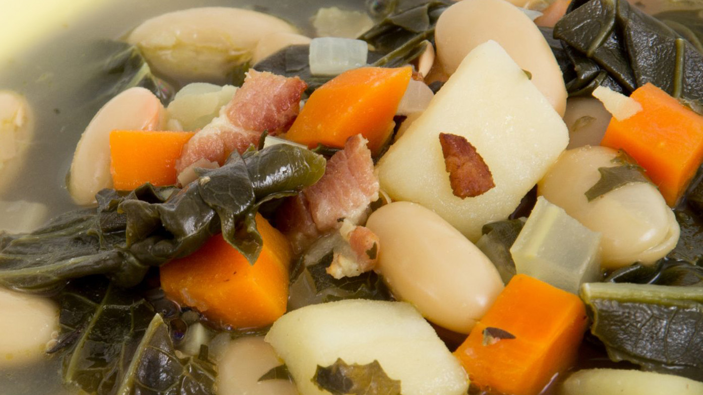 Image of a bowl of White Bean Soup with Bacon & Kale