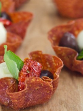 Image of salami cups filled with olives and bocconcini