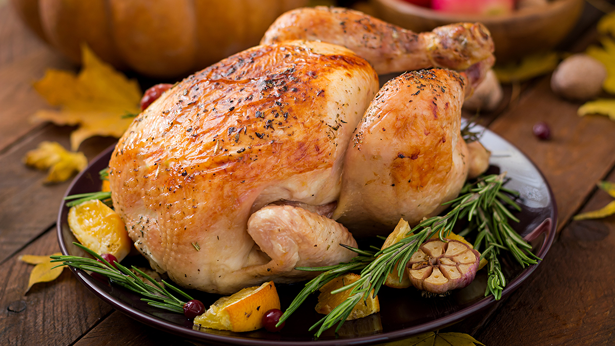 Image of roast chicken on a wooden table